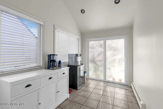 a view of a livingroom with an empty space and a window