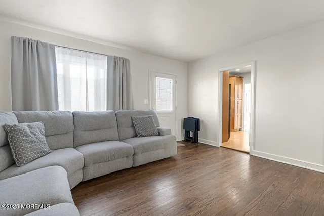 a view of a workspace with furniture and a workspace