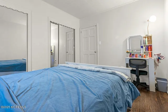 a bedroom with a bed and a table