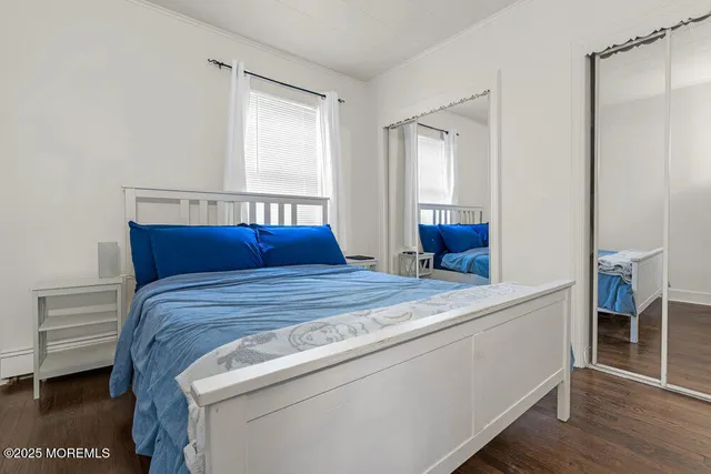 a bedroom with a bed and a lamp