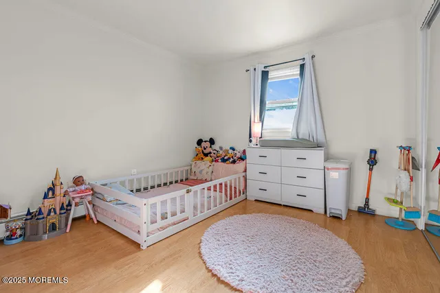 a bedroom with a bed and a closet