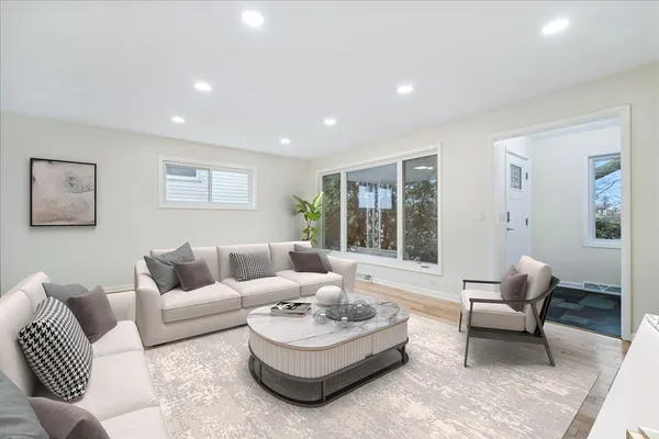 a living room with furniture and a large window