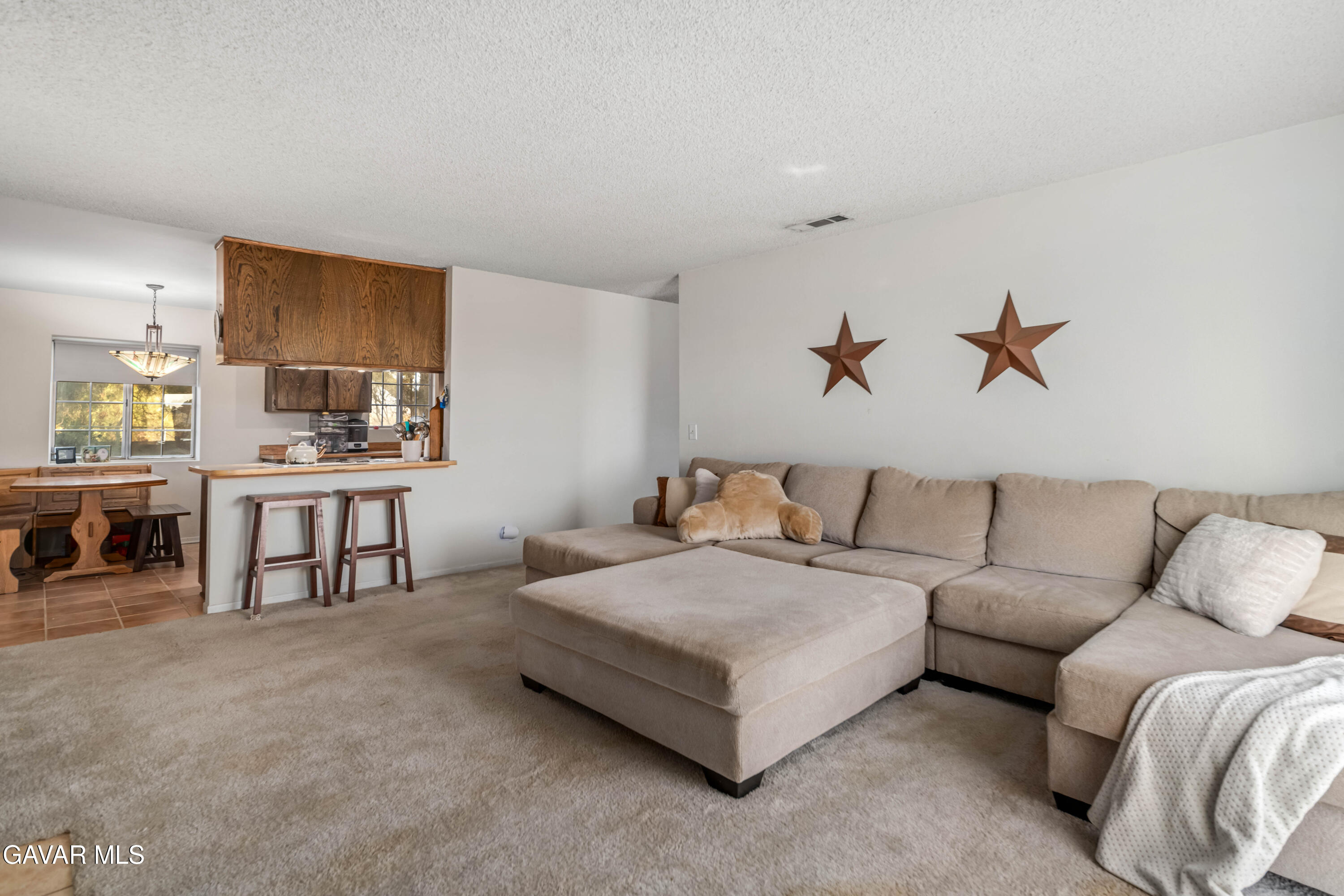 20539 East Ave R Palmdale, CA 93591 - Photo 21 of 55 a living room with furniture and a lamp