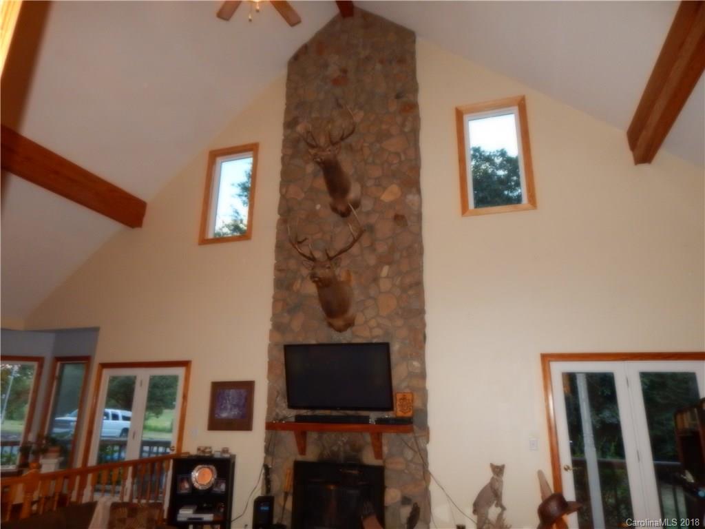 6026 Fish Road Marshville, NC 28103 - Photo 16 of 45 a living room with furniture a flat screen tv and a window