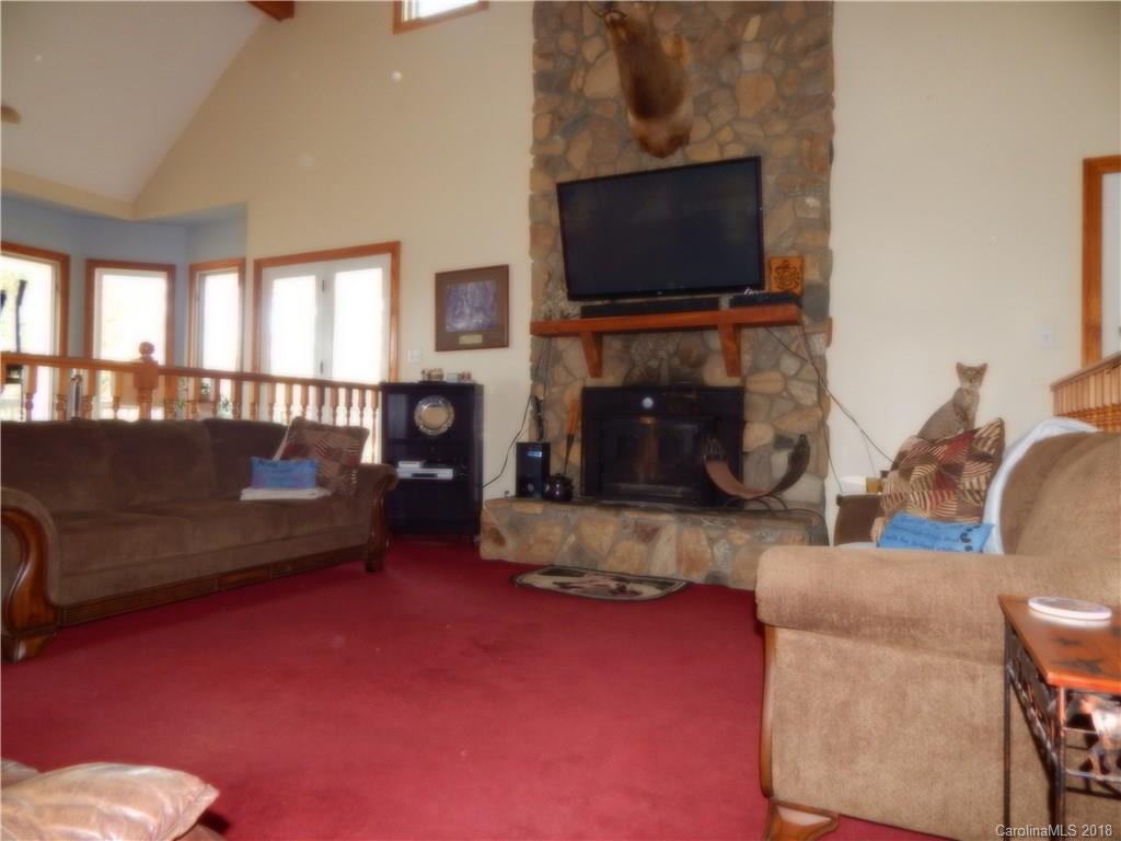 6026 Fish Road Marshville, NC 28103 - Photo 17 of 45 a living room with fireplace furniture and a flat screen tv