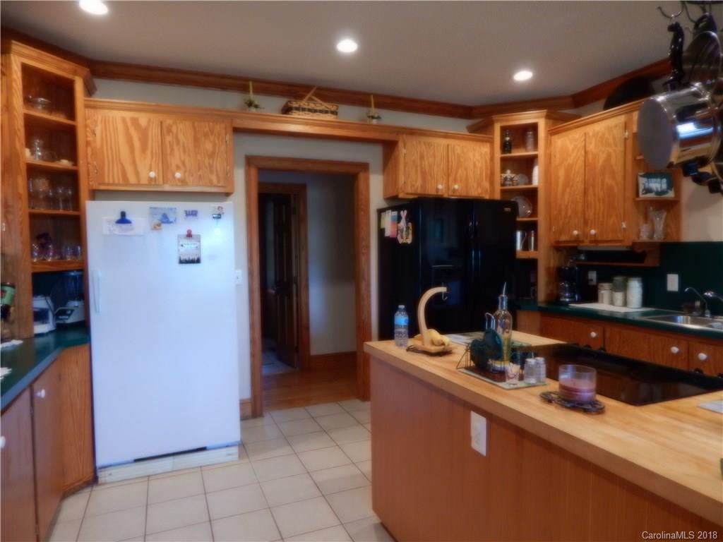 6026 Fish Road Marshville, NC 28103 - Photo 21 of 45 a kitchen with stainless steel appliances granite countertop a refrigerator and a sink