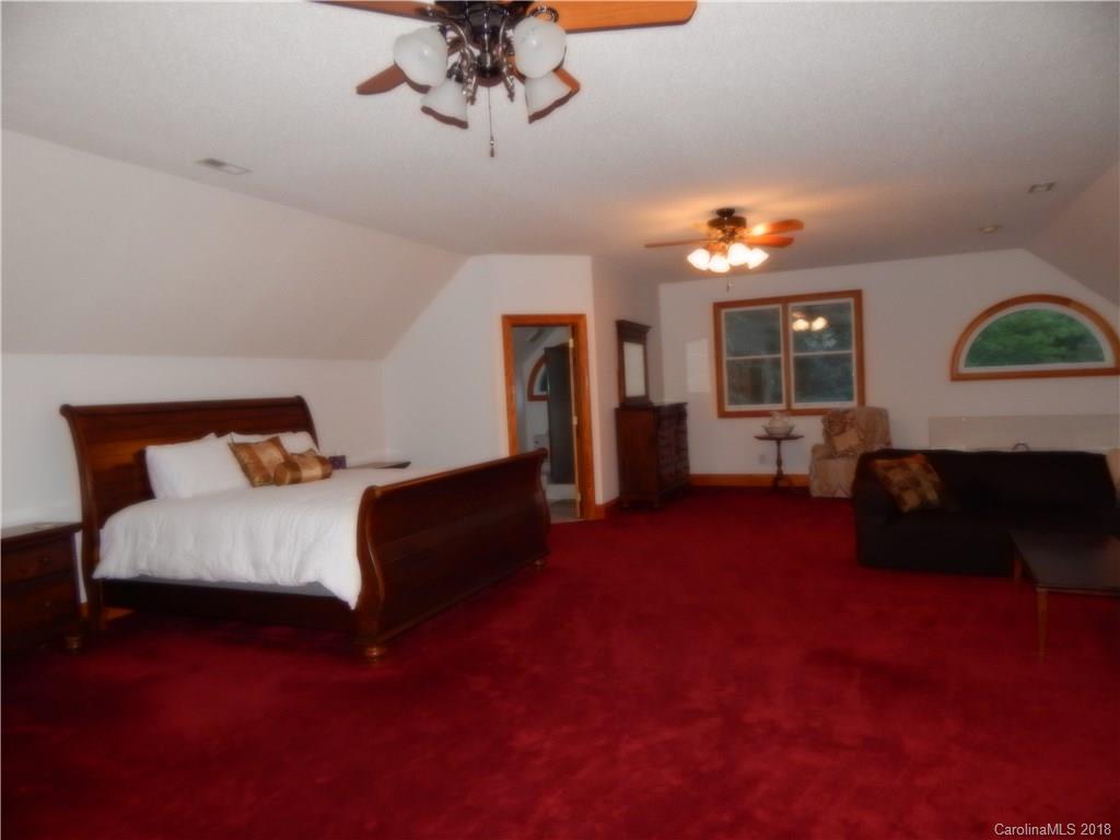 6026 Fish Road Marshville, NC 28103 - Photo 30 of 45 a bedroom with furniture and a wooden floor