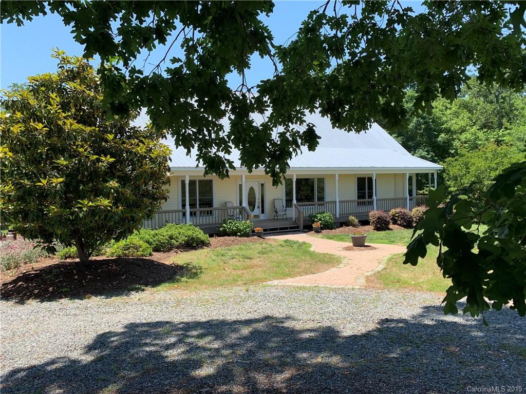 6026 Fish Road Marshville, NC 28103 - Photo 3 of 45 a view of a house with a tree in a yard