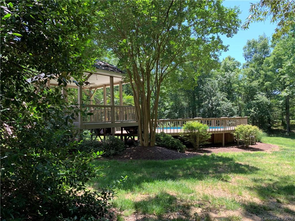 6026 Fish Road Marshville, NC 28103 - Photo 31 of 45 a backyard of a house with table and chairs