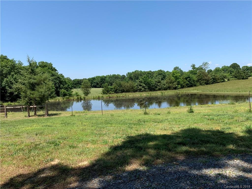6026 Fish Road Marshville, NC 28103 - Photo 4 of 45 a view of a lake with houses in the back