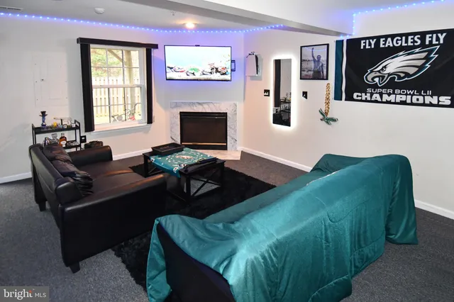 a living room with furniture rug and window
