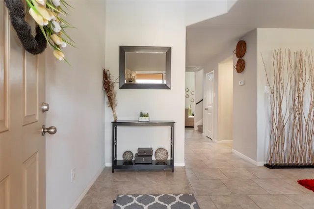 a kitchen with granite countertop stainless steel appliances and wooden cabinets