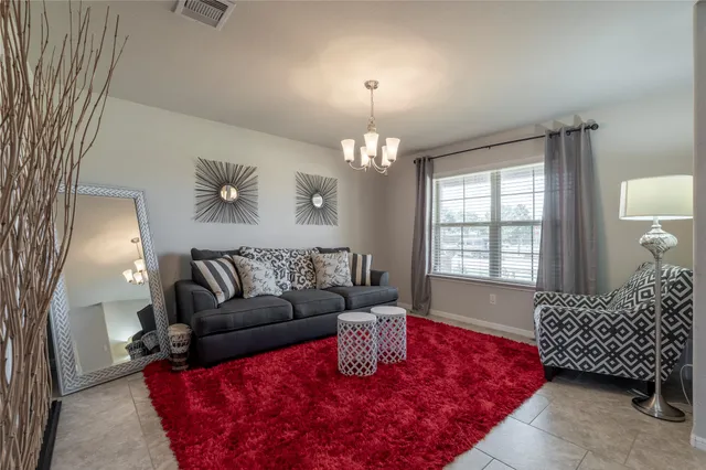 a kitchen with stainless steel appliances granite countertop a stove a sink a microwave and a refrigerator