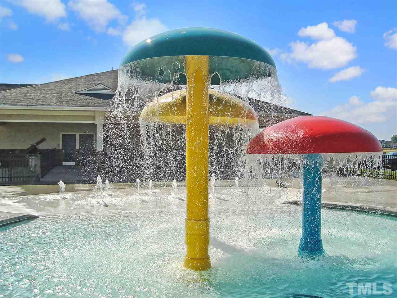 142 Jade Street Smithfield, NC 27577 - Photo 5 of 10 a view of a patio with a table and chairs under an umbrella