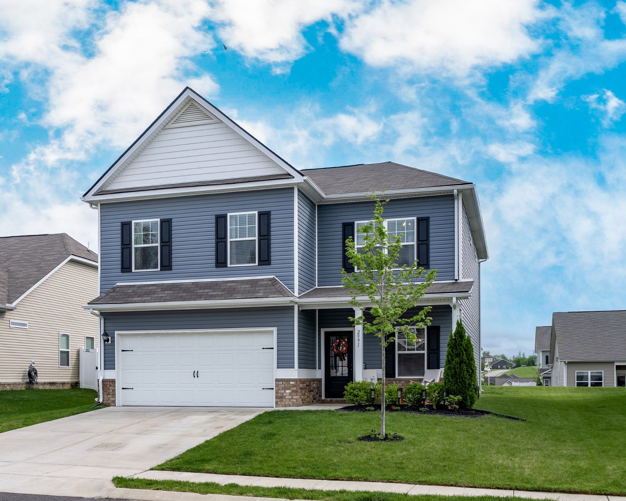 a front view of a house with a yard