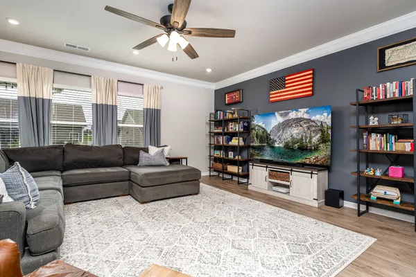 a living room with furniture workspace and a window
