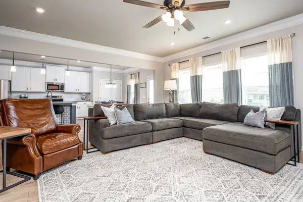 a living room with furniture and a large window