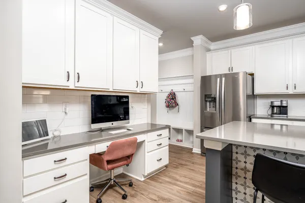 a kitchen with stainless steel appliances a stove refrigerator sink and microwave