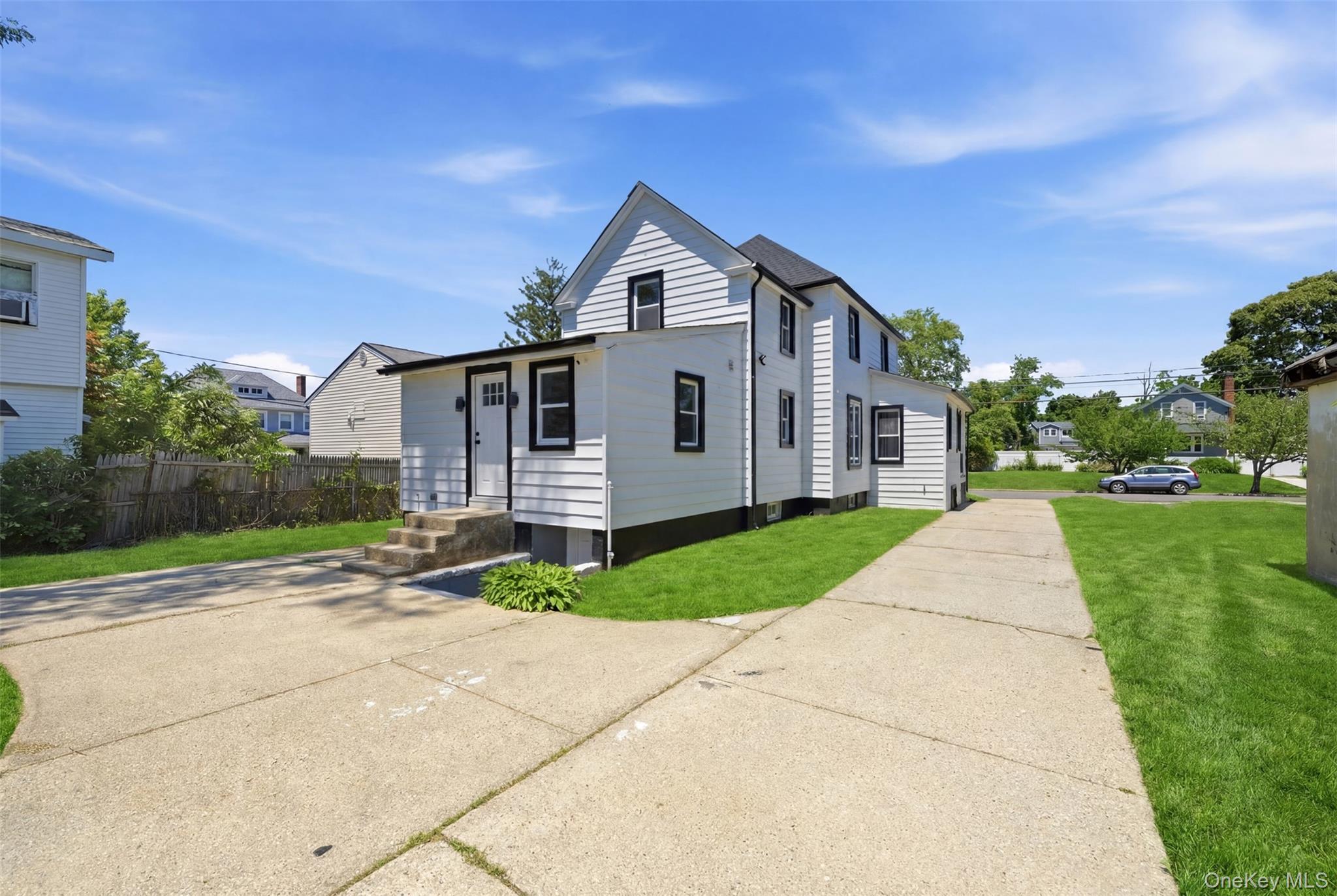 135 Whaley Street Freeport, NY 11520 - Photo 34 of 38 a view of a house with a yard