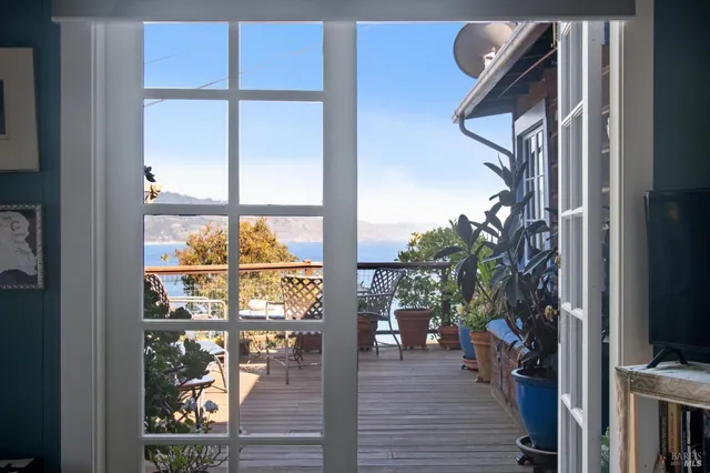 a view of a chair and table in the balcony