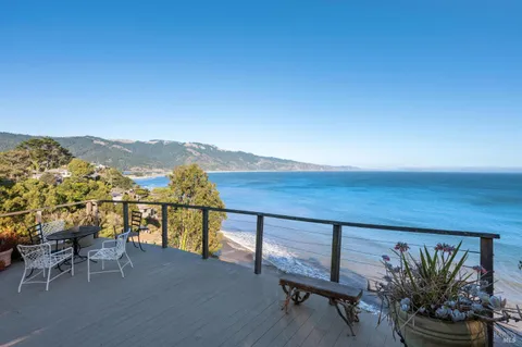 a bedroom with a bed and a dresser next to a window