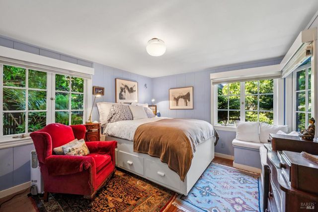 a living room with furniture and windows