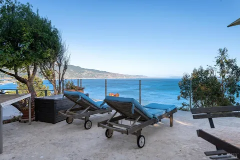 a view of a terrace with sitting area