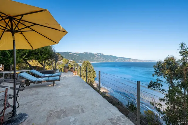 a view of a backyard with sitting area and furniture