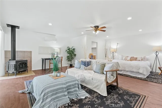 a living room with furniture a fireplace and a chandelier