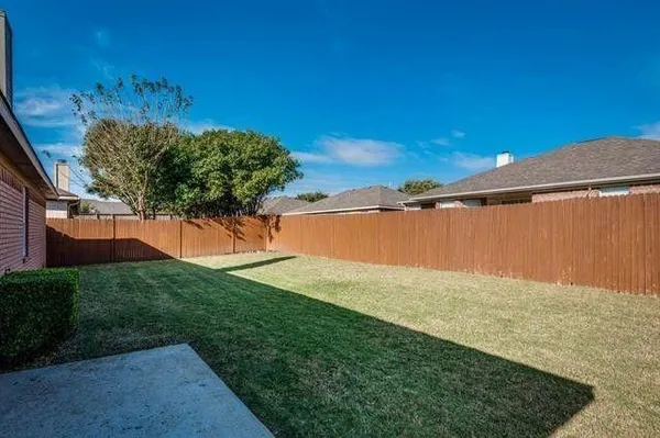 a view of a yard with a view of a field