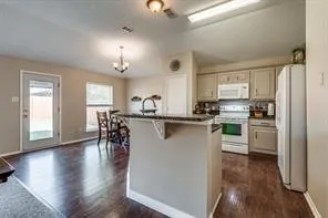 a kitchen with counter top space and appliances