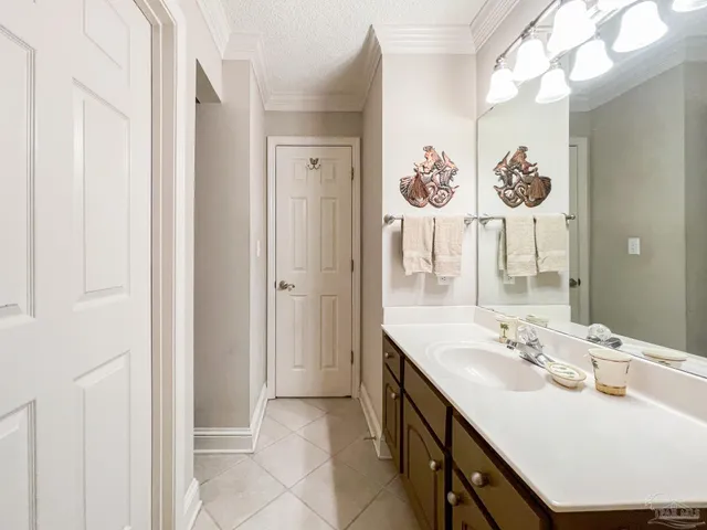 a bathroom with a sink vanity and a mirror