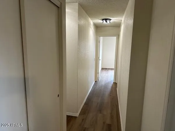 a bathroom with a sink a toilet and shower curtain