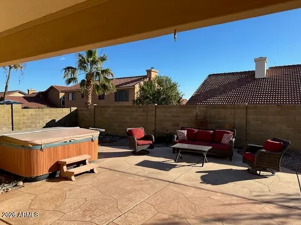 a view of a backyard with sitting area