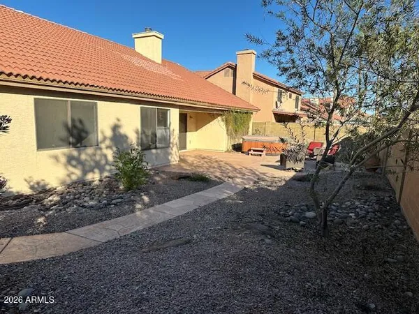a view of a swimming pool and a yard