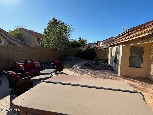a swimming pool with outdoor seating and yard