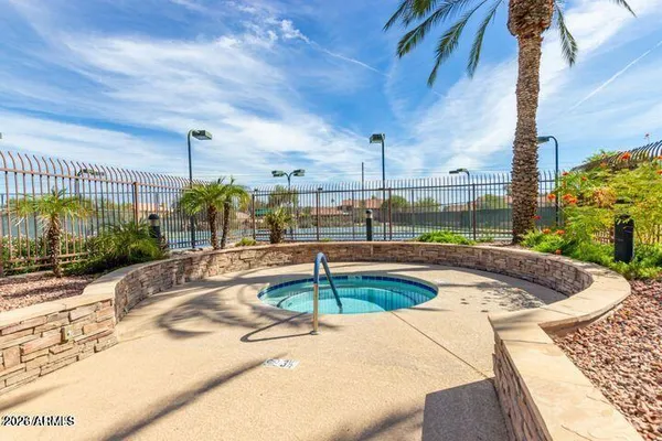 a view of a livingroom with wooden floor and a fireplace