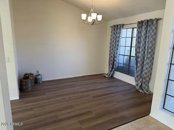 a view of a hallway view with wooden floor and staircase
