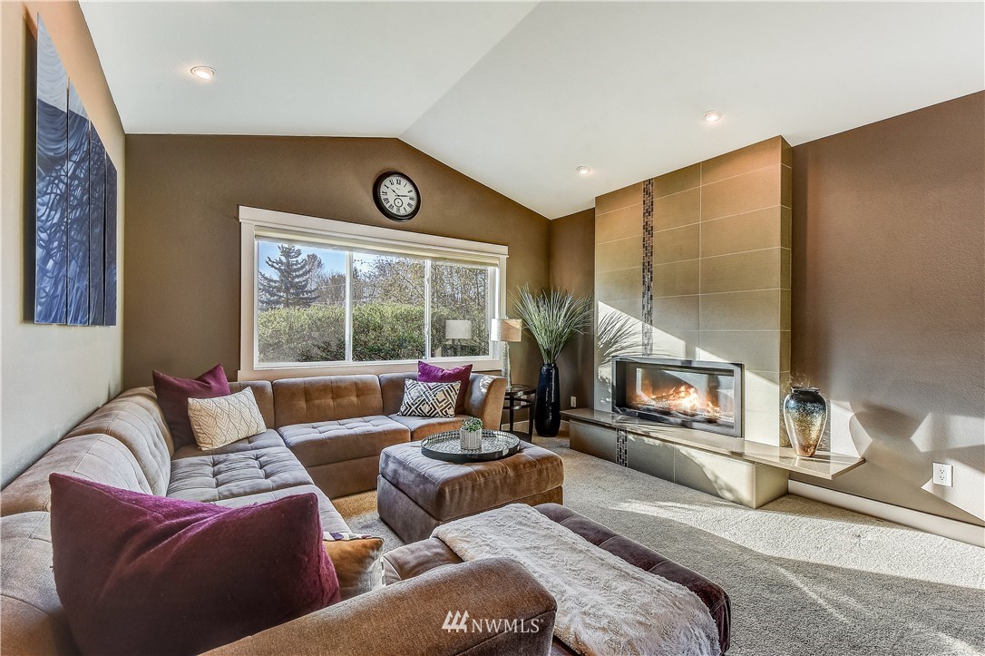 1307 221st Place Southwest Bothell, WA 98021 - Photo 2 of 20 a living room with furniture and a large window