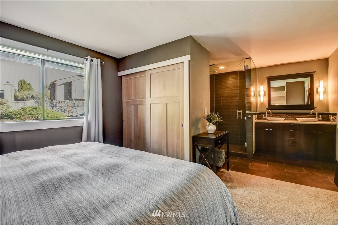 1307 221st Place Southwest Bothell, WA 98021 - Photo 13 of 20 a bedroom with a bed and a view of bathroom