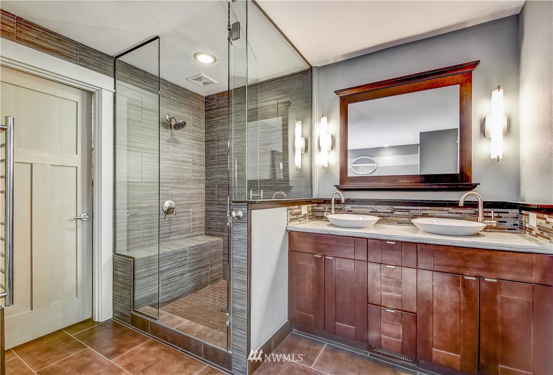 1307 221st Place Southwest Bothell, WA 98021 - Photo 14 of 20 a bathroom with a double vanity sink mirror and shower