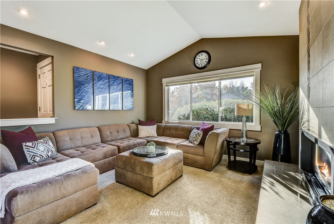 1307 221st Place Southwest Bothell, WA 98021 - Photo 3 of 20 a living room with furniture and a large window