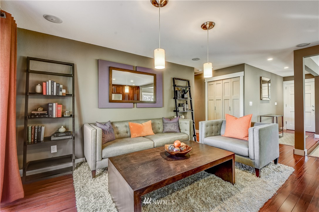 1307 221st Place Southwest Bothell, WA 98021 - Photo 10 of 20 a living room with furniture and wooden floor