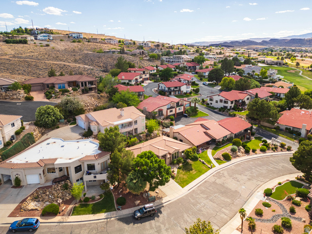2158 Balboa Way St. George, UT 84770 - Photo 39 of 40 Aerial perspective of a residential neighborhood featuring varied architectural styles and red tile roofs