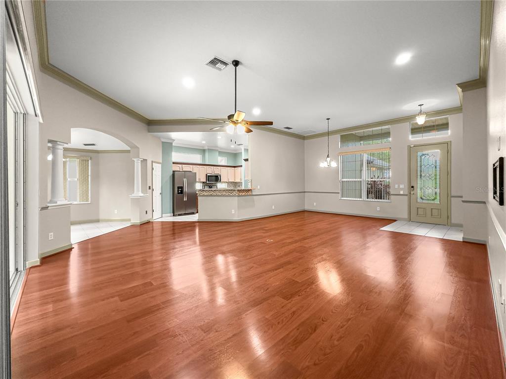 8045 Waterbury Way Mount Dora, FL 32757 - Photo 19 of 56 a view of a kitchen with a sink and a refrigerator