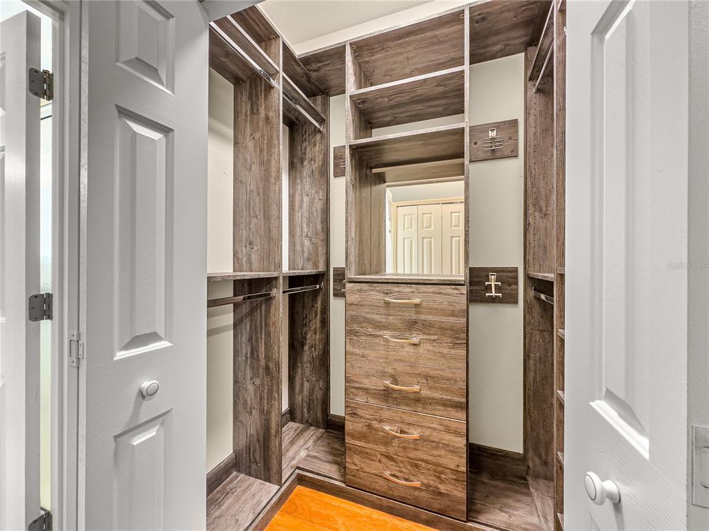 8045 Waterbury Way Mount Dora, FL 32757 - Photo 24 of 56 a bathroom with a tub and shower