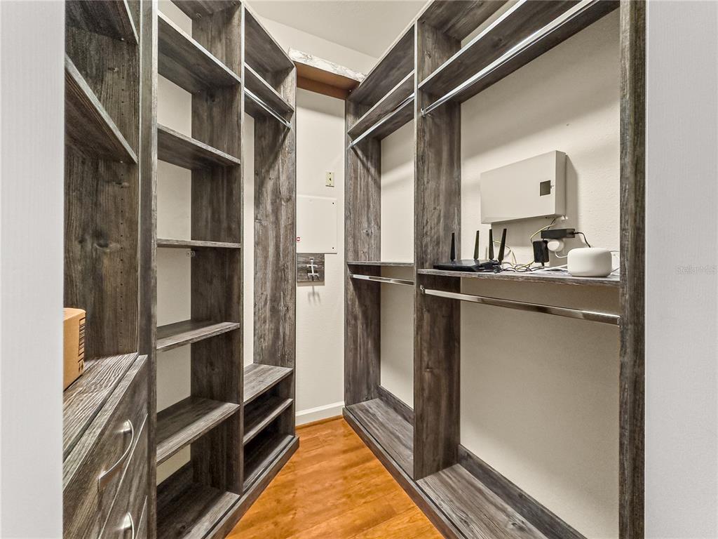 8045 Waterbury Way Mount Dora, FL 32757 - Photo 25 of 56 a view of walk in closet with clothes and shoes