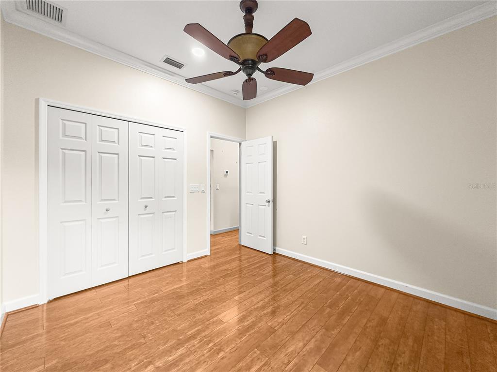 8045 Waterbury Way Mount Dora, FL 32757 - Photo 28 of 56 wooden floor in an empty room