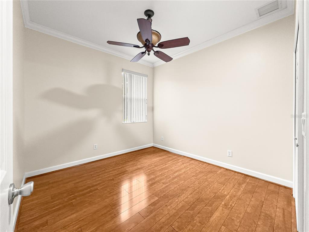 8045 Waterbury Way Mount Dora, FL 32757 - Photo 29 of 56 a view of empty room with wooden floor