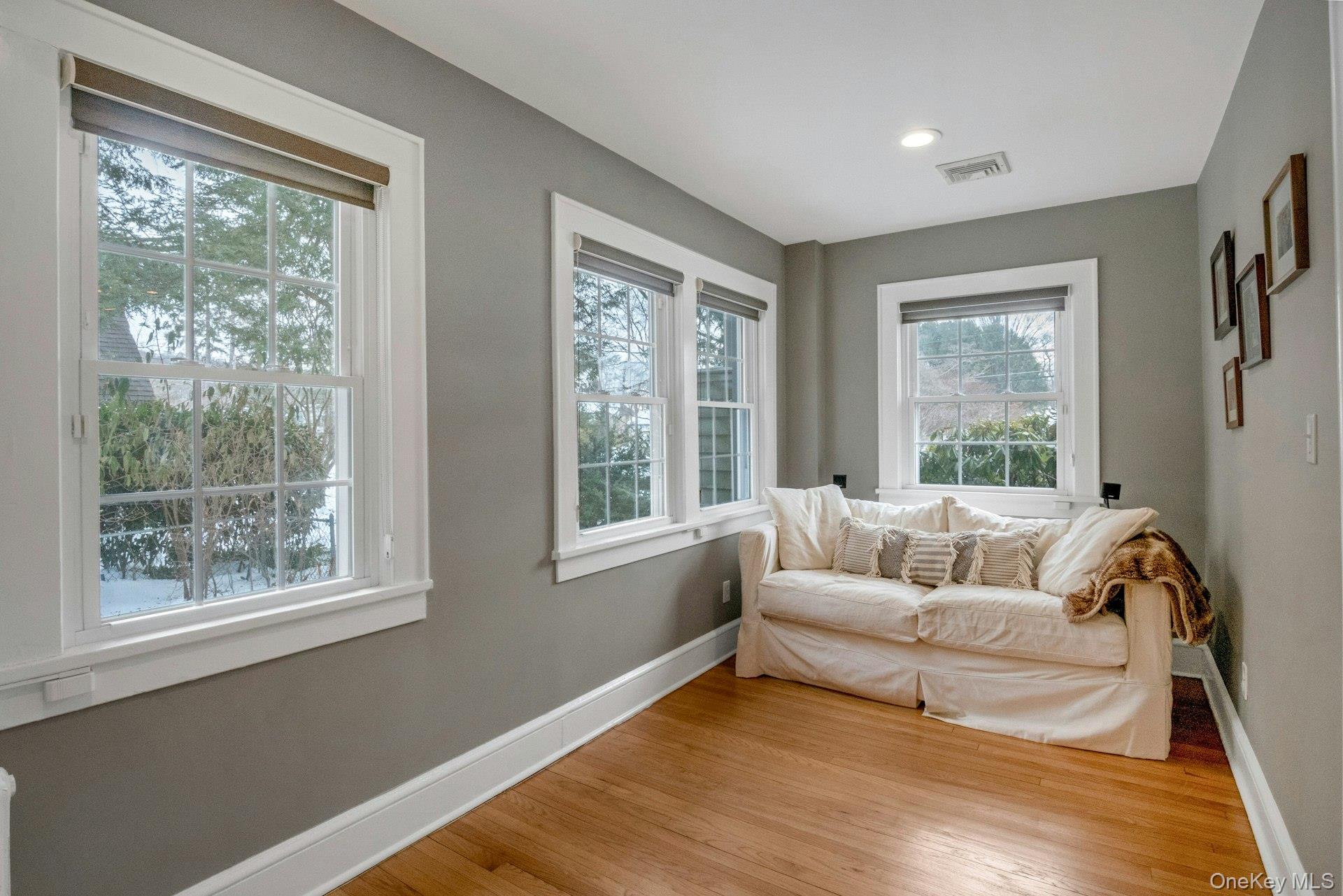 25 Maple Road Briarcliff Manor, NY 10510 - Photo 17 of 48 Alternate view of the Family Room with walls of windows & gleaming hardwood floors.